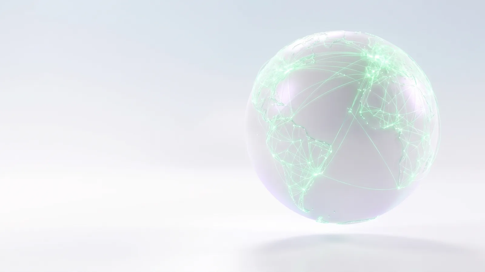 A white glass globe covered in a fine mesh of green light lines.