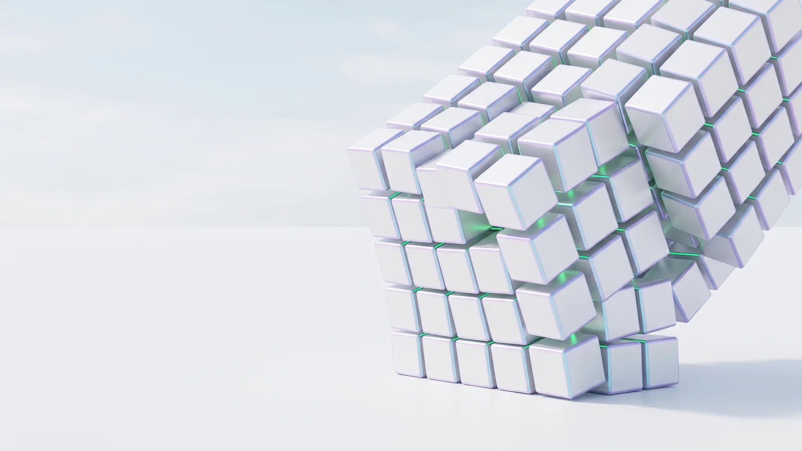 Many small white cubes locking together into one larger block.
