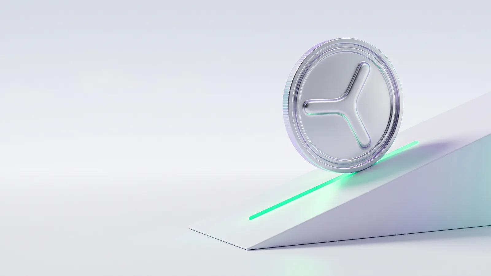 A silver coin with the YOM mark on a white ramp lit by a green line.