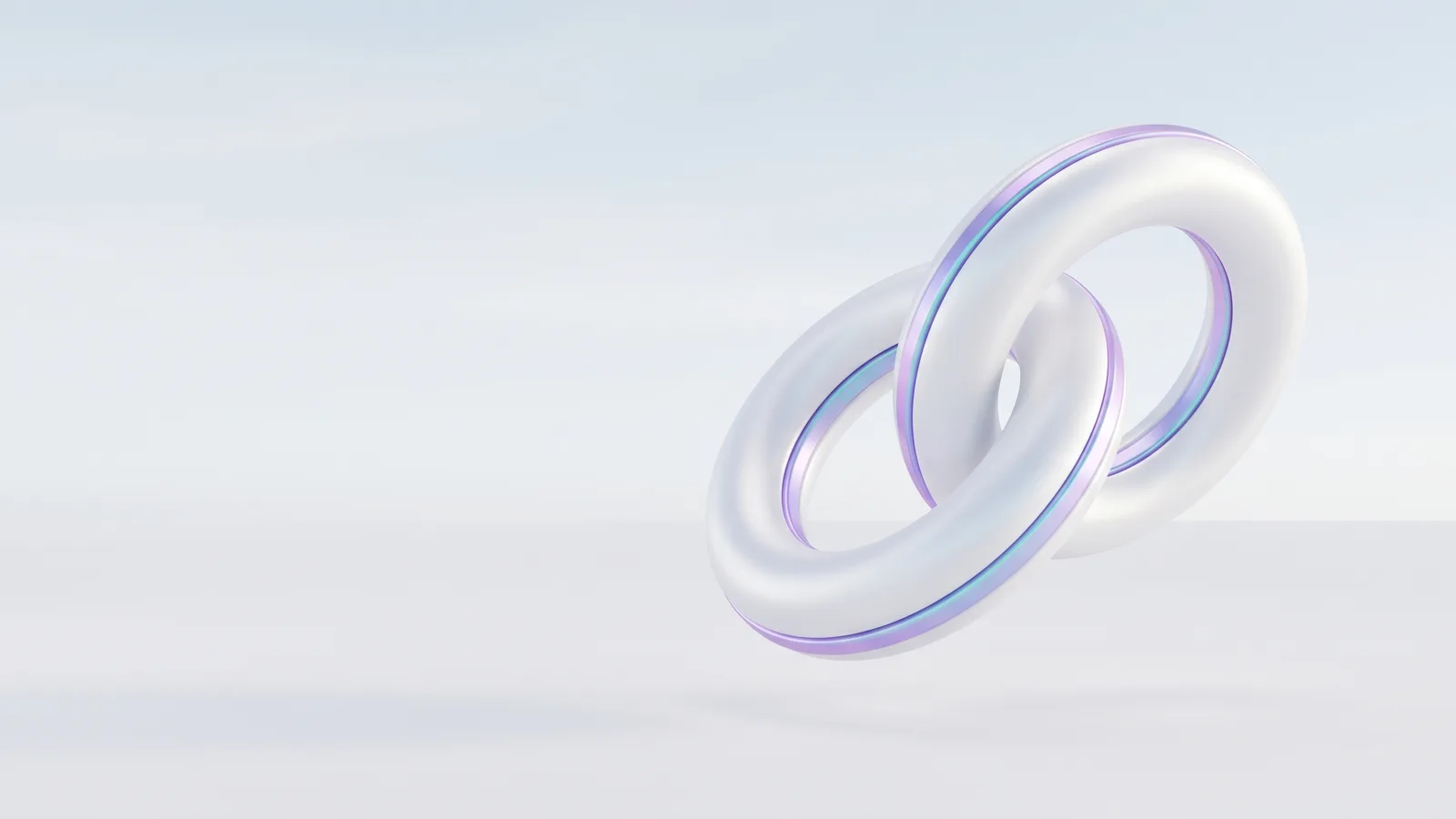 Two white rings linked together in mid-air.